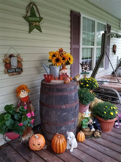 Whiskey Barrel Scarecrow Pumpkins And Mums Decorating Our Porch Whiskey Barrel Decor