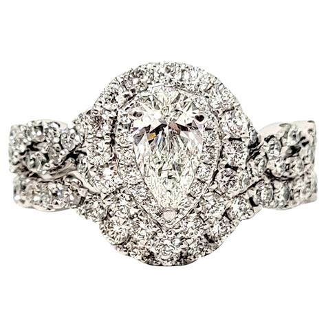 neil lane pear and round diamond halo wedding ring set in 14 karat white gold for sale at