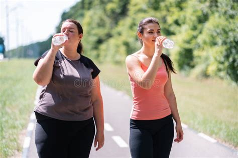 Women Drink Water And Rest After Outdoor Jogging Stock Photo Image Of