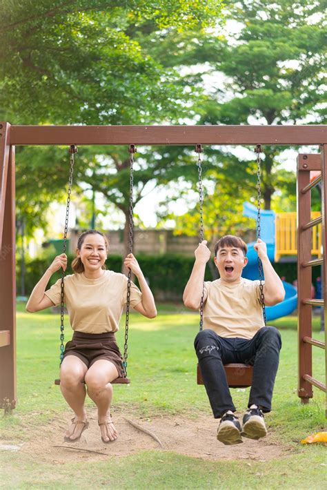 Premium Photo Asian Couple Love Play On The Swing