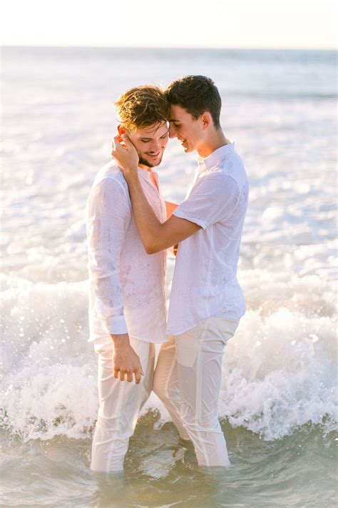 romantic engagement photos on the beach in kauai hawaii lgbtq weddings engaged two grooms gay