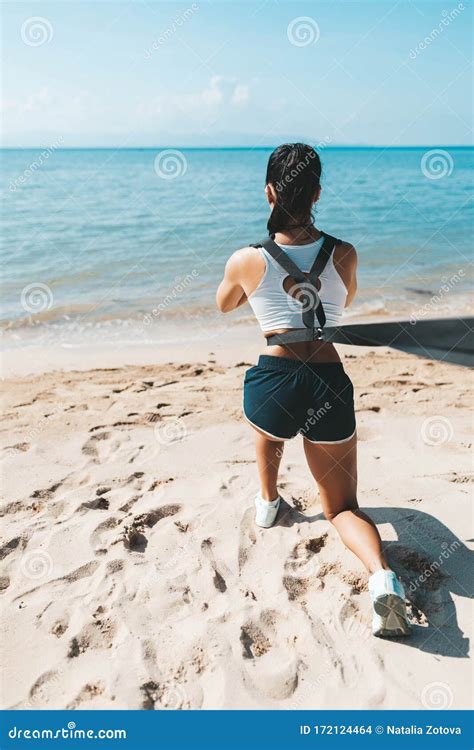 Woman Squatting In Eco Gym On The Beach Stock Photo Image Of Health