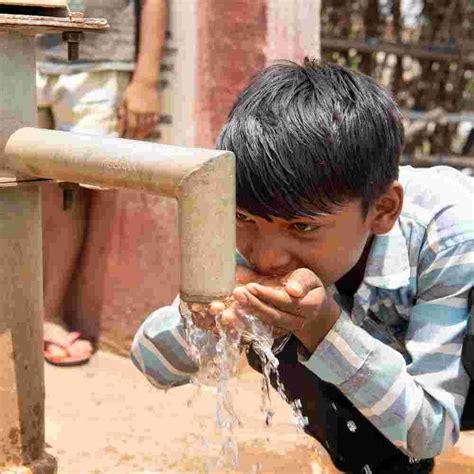 Young Boy Drinking Clean Water From Gfa World Jesus Wells Gospel For
