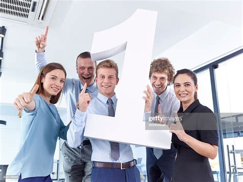 Business People Holding Large Number 1 High Res Stock Photo Getty Images
