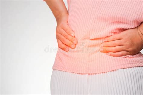 Back View Of Woman Suffering From Backache Waist Pain Muscle Or