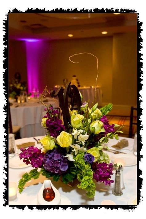 Purple And Green Centerpiece By Izas Flowers Inc Weddingsbyiza