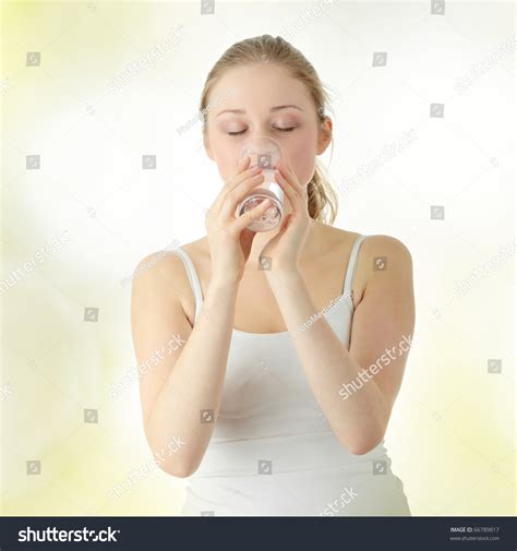 Young Woman Drinking Fresh Cold Water From Glass Stock Photo 66789817