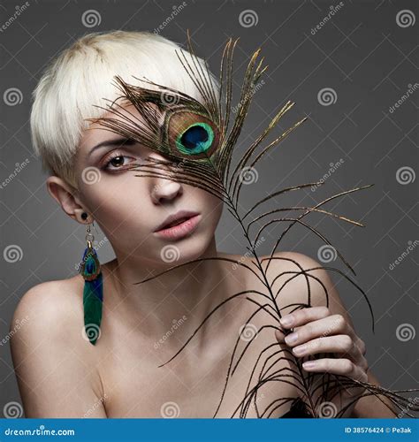 Attractive Blond Woman Holding Peacock Feather Stock Images Image