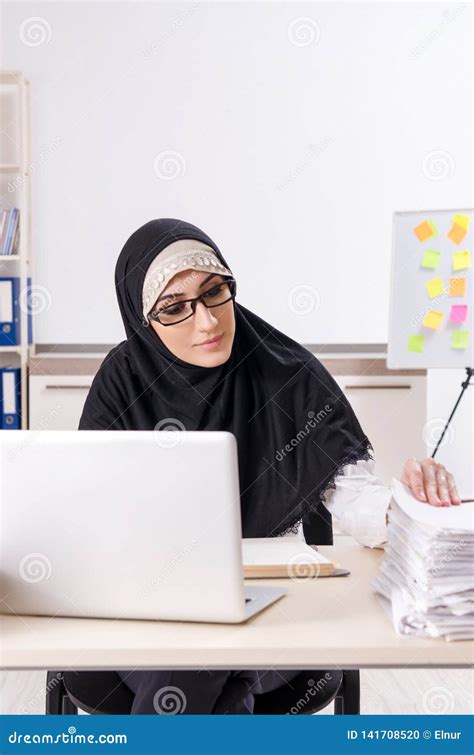 The Female Employee In Hijab Working In The Office Stock Photo Image