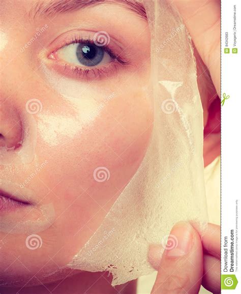 woman removing facial peel off mask closeup stock image image of clear facial 84342683