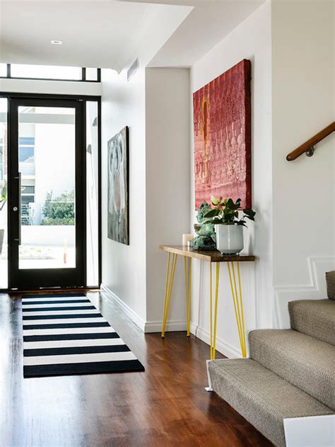 In this modern home by peti lau,. Modern Entrance Hall Home Design Ideas, Pictures, Remodel ...