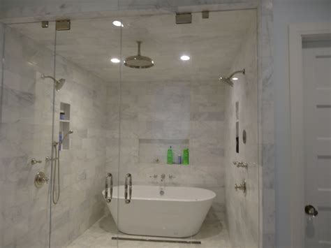 Imagine a large walk in shower, and once you get inside, there is a bathtub. Steam shower with marble tiles. Swing in and out doors ...