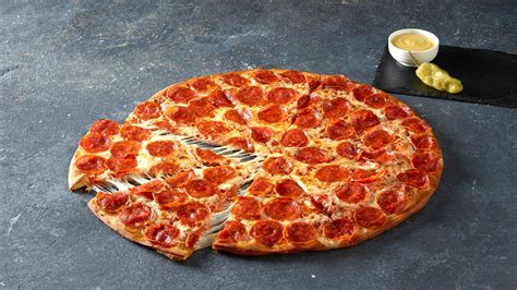 Shaq and Papa John’s have teamed up to launch an extra-large Shaq-a