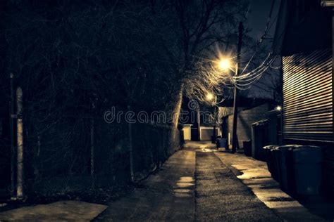 Dark Gritty And Wet Industrial City Alley At Night Stock Image Image