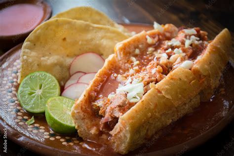 Authentic Mexican Torta Ahogada Pork Meat Sandwich Soaked In Hot Tomato