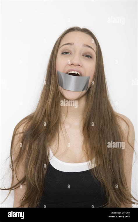 Woman With Tape Over Mouth Stock Photo Alamy