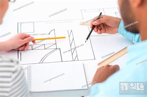 Drawing Up Plans Top View Of Two Successful Architect Reviewing