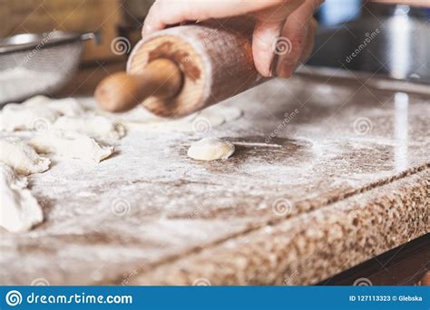 Female Hands Roll Out Dough With Wooden Rolling Pin Stock Image Image