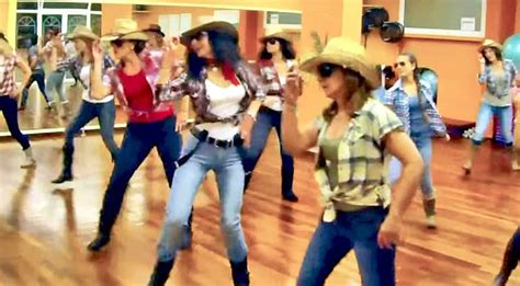 Cowgirls Kick Up Their Heels In Brooks And Dunn Line Dance Country