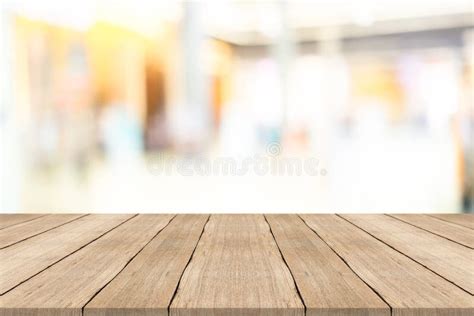 Empty Wooden Table Top On Blurred Background At Shopping Mall Stock