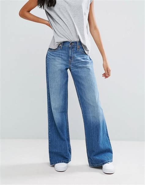 Модели широких женских джинсов 80 фото