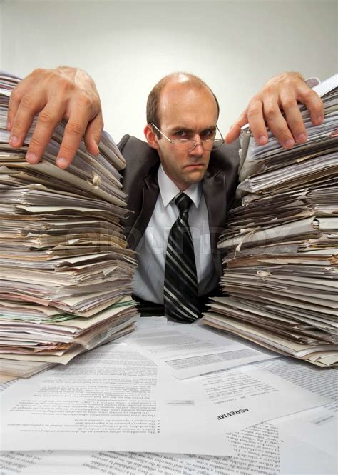Businessman With Big Piles Of Paperwork Stock Image Colourbox