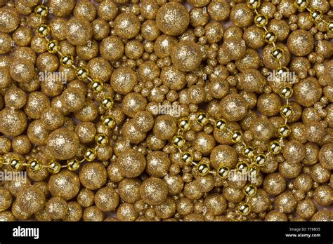 Christmas Background With Big And Small Golden Glitter Balls And Golden