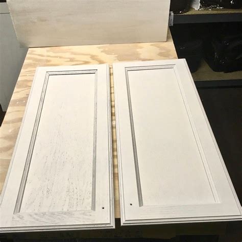 To apply it, you just take a spackling knife and run it all the way down the length of the cabinet door, filling in every little crack, then remove any excess. Kitchen Makeover - White Cabinet Wood Grain Filler ...