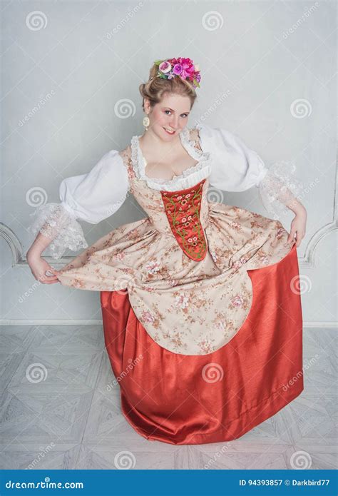 Beautiful Woman In Old Fashioned Medieval Dress Doing Curtsy Stock