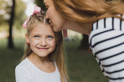 Premium Photo Kissing Daughter Loving Blonde Haired Mother Feeling