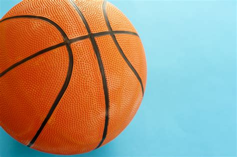 Free Image Of Close Up Basketball Ball On Sky Blue Background Freebie