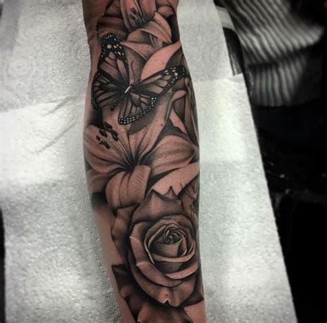 The lily of the valley and moth tattoo. Lilies and rose | Best sleeve tattoos, Sleeve tattoos