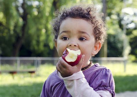 Child Eating Apple Steward Health Care