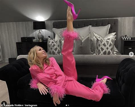 amanda holden flaunts her flexibility as she poses with her leg straight up in