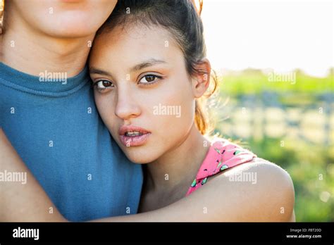 Young Woman Embracing Boyfriend Portrait Stock Photo Alamy