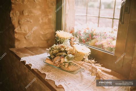 Various Flowers Bouquet On Window Sill In Sunlight — Decoration