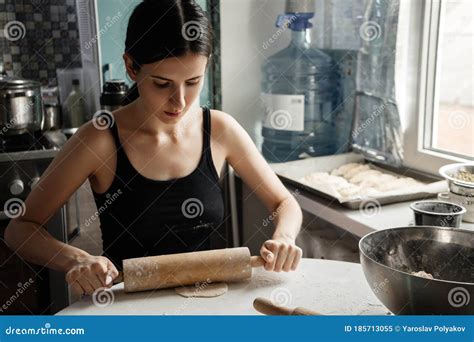 Russian Woman Beatifull Brunette Kneading Bread Dough With Rolling Pin
