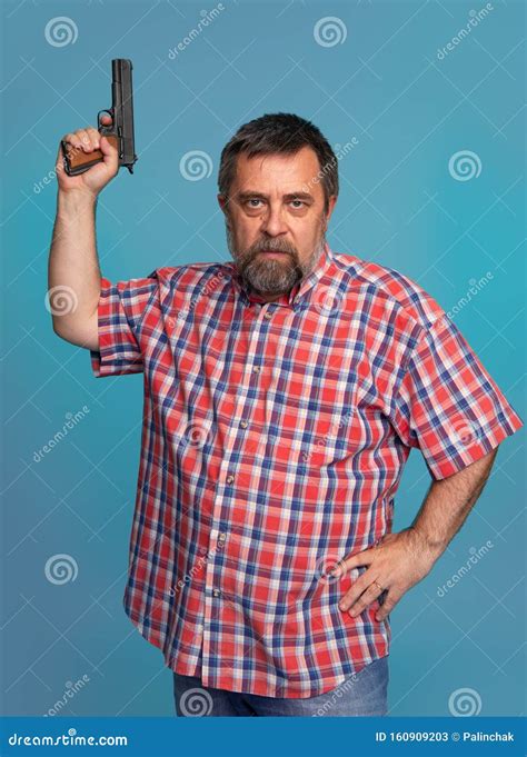 Portrait Of A Handsome Man Holding A Gun Stock Image Image Of Danger