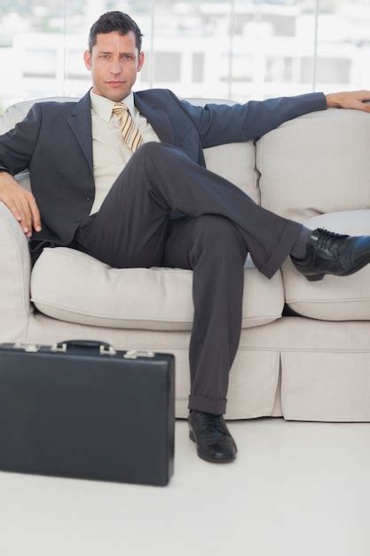 Businessman Sitting With Legs Crossed On The Couch Photo Premium Download