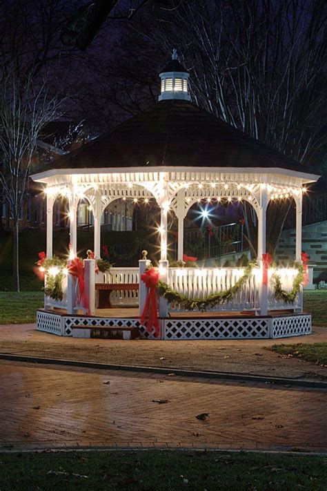 Stunning Gazebo Lit With Fairy Lights And Decorated With Red Ribbons