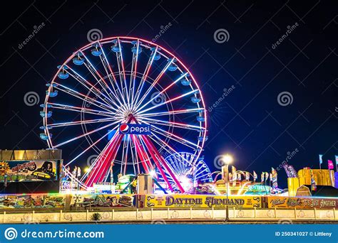 Ocean City Maryland Boardwalk On A Summer Night With Fun Colorful Rides