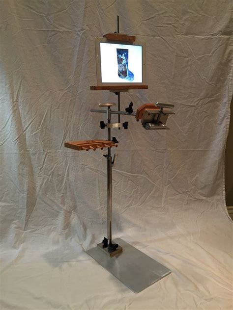 Stainless steel l divider are commonly seen in many places. Stainless Steel Floor Stand with Tablet/Pattern Holder ...