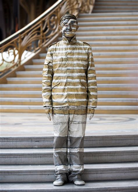Your Turn Liu Bolin Fitting In Reading The Pictures