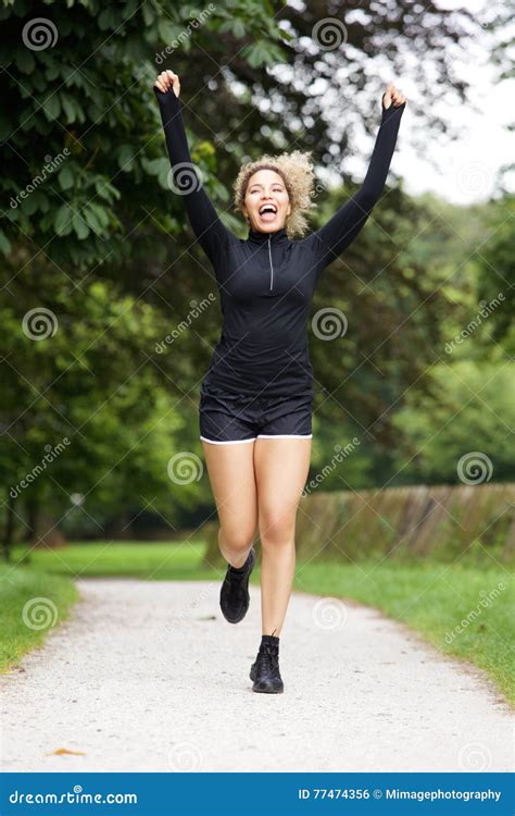 Portrait Of Runner With Arms Raised Stock Photo Image Of Outside