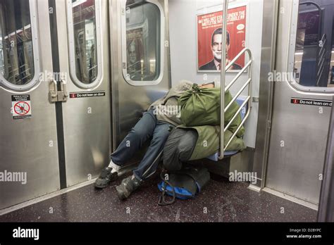 Homeless Man Escapes The Cold And Sleeps In A Subway Car In New York On