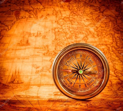 Vintage Compass Lies On An Ancient World Map Stock Photo By ©cookelma