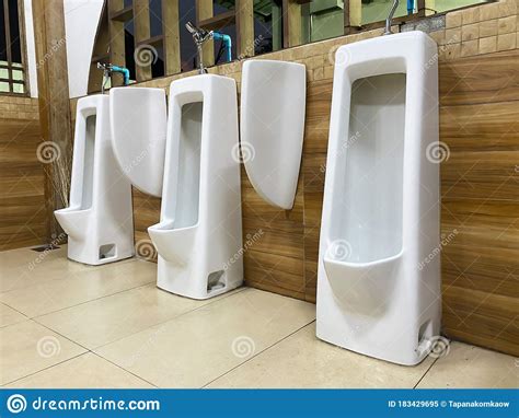 Men`s White Urinals Design Close Up Row Of Outdoor Urinals Men Public Toilet Stock Image