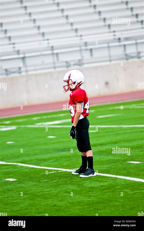 Youth Football Player On The Field Stock Photo Alamy