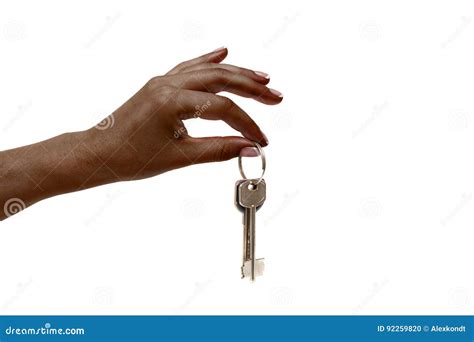 African Female Hand Holds Keys On White Background Stock Photo Image