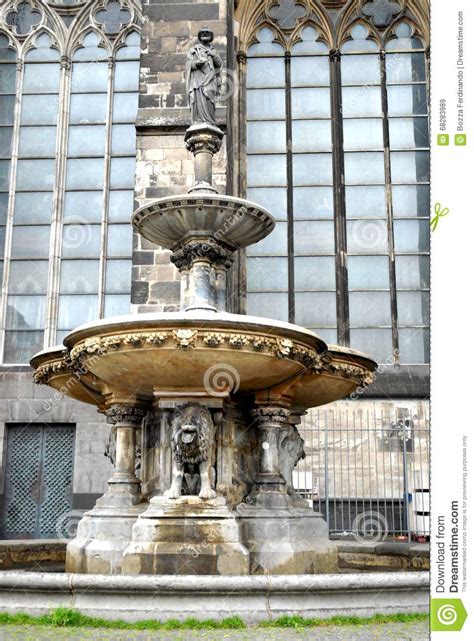 Fountain With The Statue Of St Peter Next To The Cologne Cathedral In
